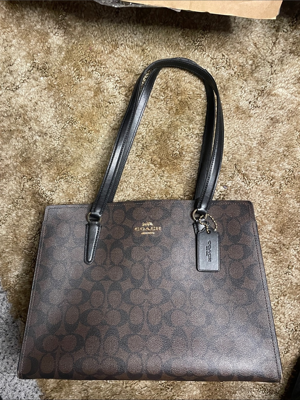 Coach dark Brown Signature
Avenue Carryall Tote with Black Handles